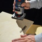 Using hand router during manufacture of FASFOOT floors