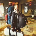 Dancer traveling with large backpacks and FASFOOT floor